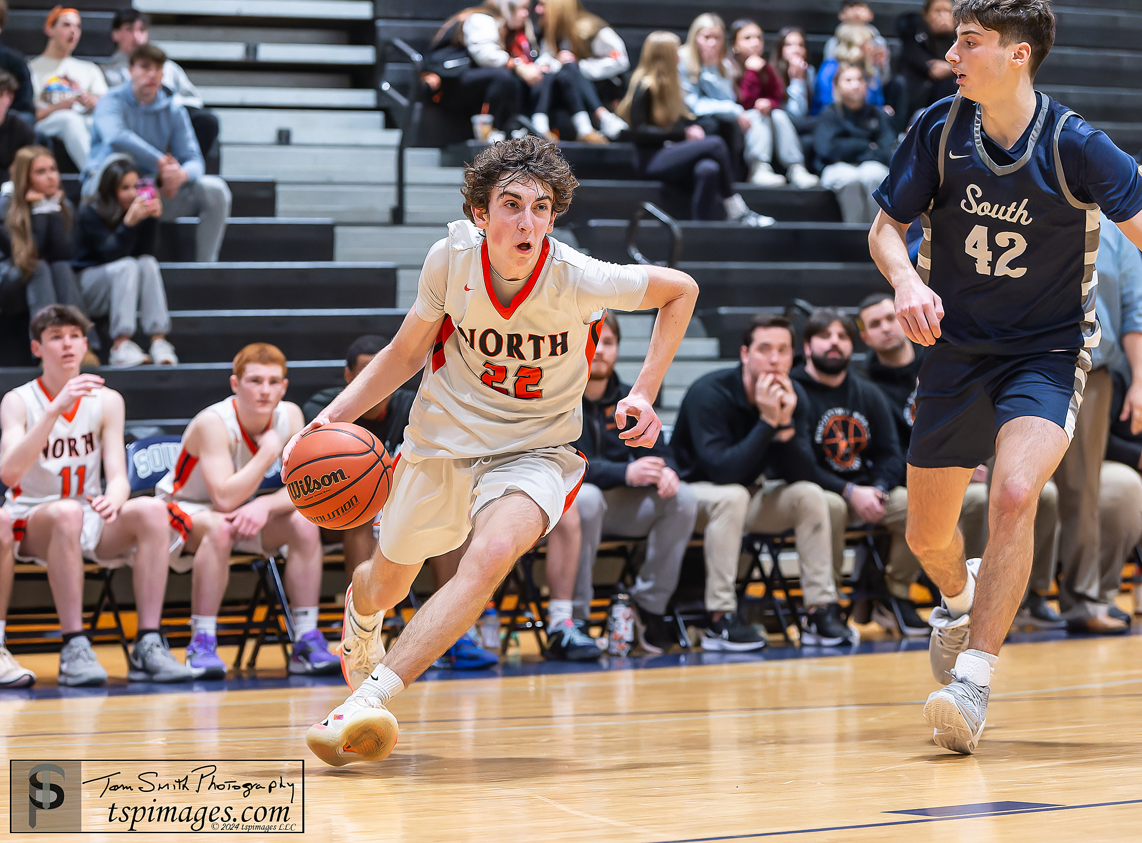 Middletown North junior Colin Byrne dribbles by Middletown South junior Brady Hahn. (Photo: Tom Smith | tspsportsimages.com)