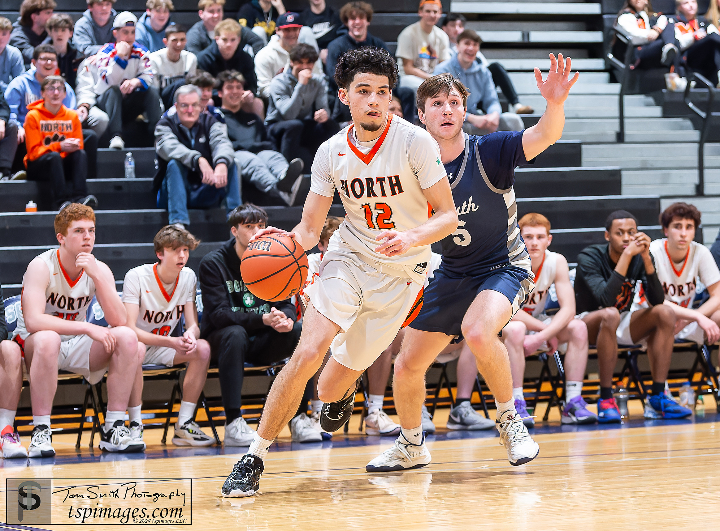 Middletown North sophomore Eddie Lopez goes by Middletown South senior Owen Richter.(Photo: Tom Smith | tspsportsimages.com)