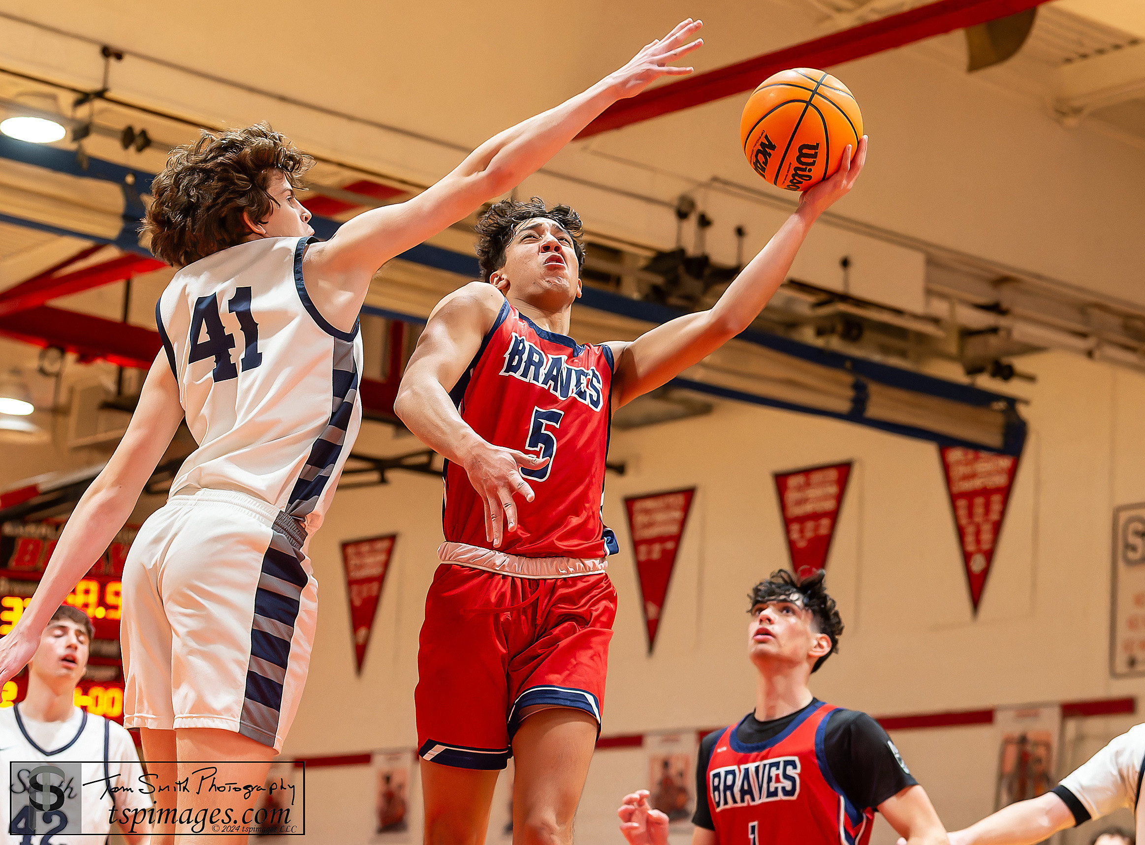 Manalapan senior Anthony Leger drives on Middletown South sophomore Beckett Oliver. (Photo: Tom Smith | tspsportsimages.com)