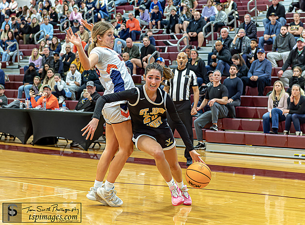 Daniella Matus drives to basket against Trinity Hall. Photo by Tom Smith