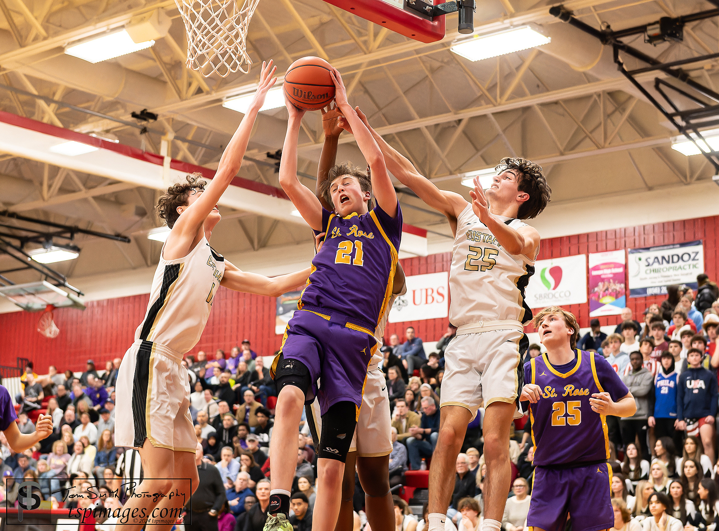 St. Rose freshman Avery Lynch goes up between Bishop Eustace defenders Dillon Adomagnis (left) and Tom Samiraglo.(Photo: Tom Smith | tspsportsimages.com)